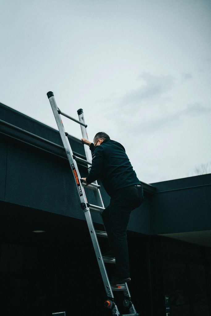 Man Climbing a Ladder
